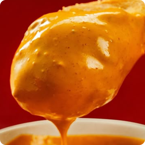 Faida Hot Sauce drizzled over air-fried chicken.